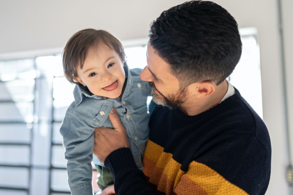 father holding baby boy