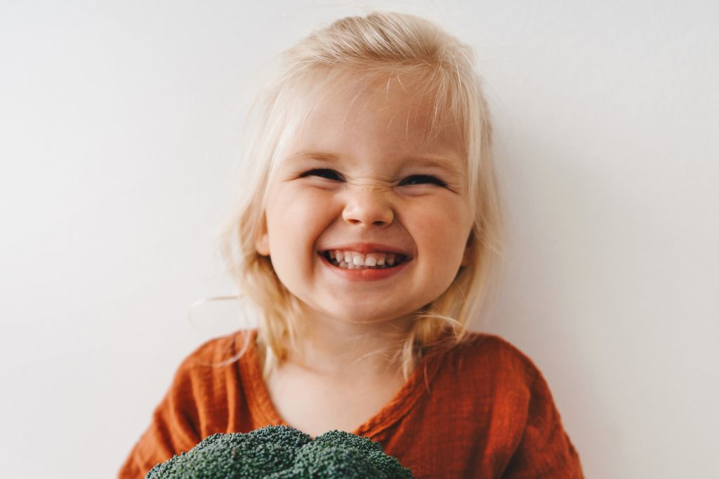 little smiling with orange shirt